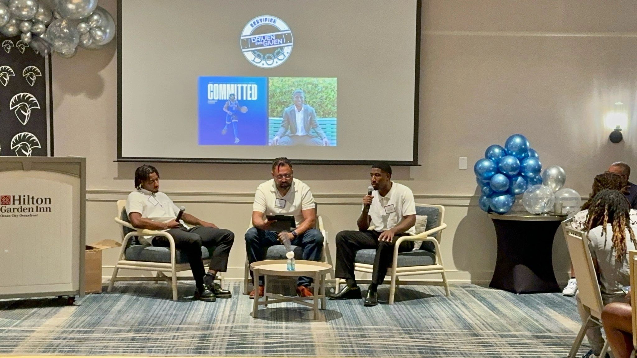 Panel discussion at the Hilton Garden Inn featuring Driven Over Given Inc. leaders and community members engaged in conversation about access, opportunity, and workforce readiness