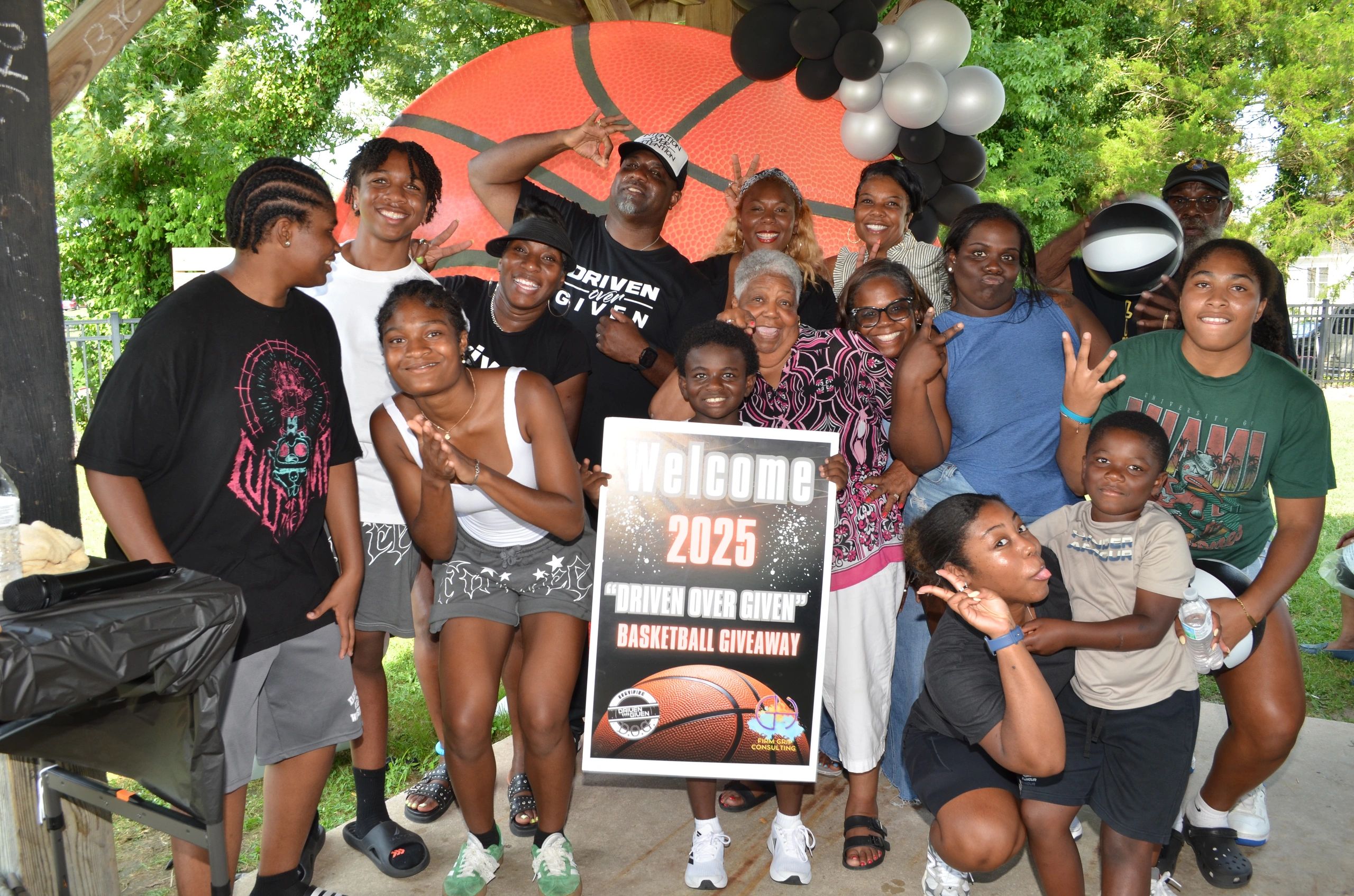 Large community group gathered at the 2025 Driven Over Given Basketball Giveaway